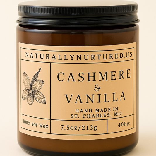 Candle jar labeled 'Naturally Nurtured' with 'Cashmere & Vanilla' scent on a beige background