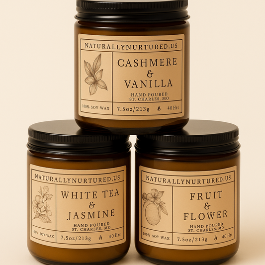 Three candles stacked on a beige background with labels indicating scents like Cashmere & Vanilla, White Tea & Jasmine, and Fruit & Flower.